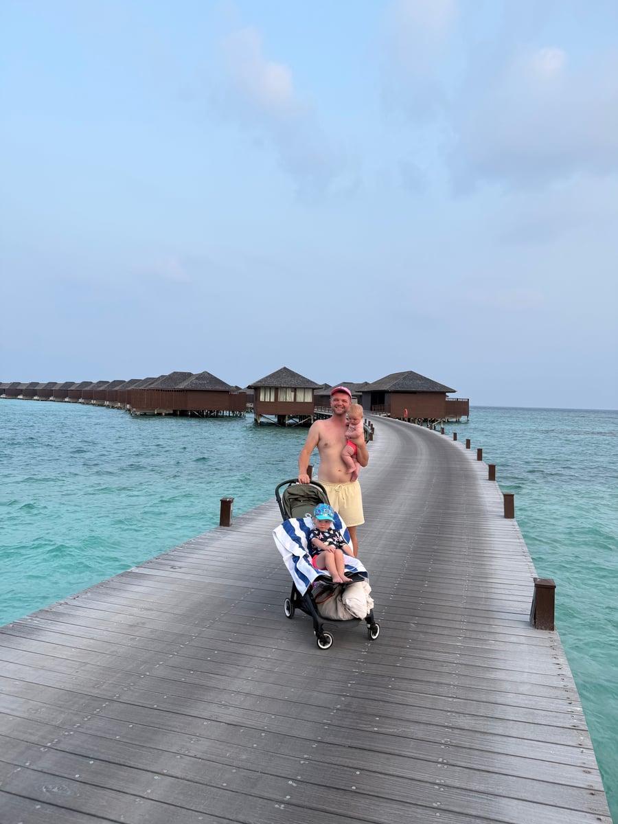 Tym Lewtak and his daughter on a Maldives villa jetty
