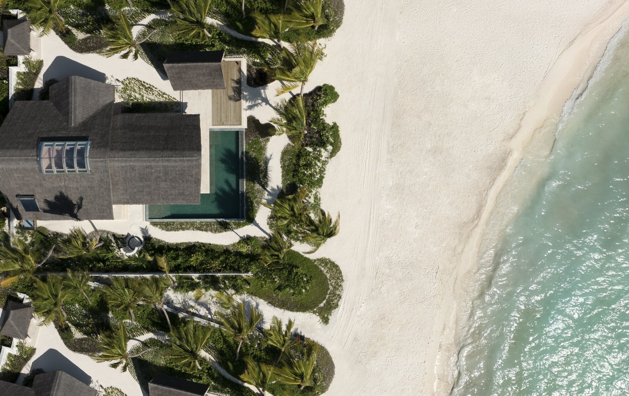 Aerial view of a beach pool villa at Don Maaga Maldives