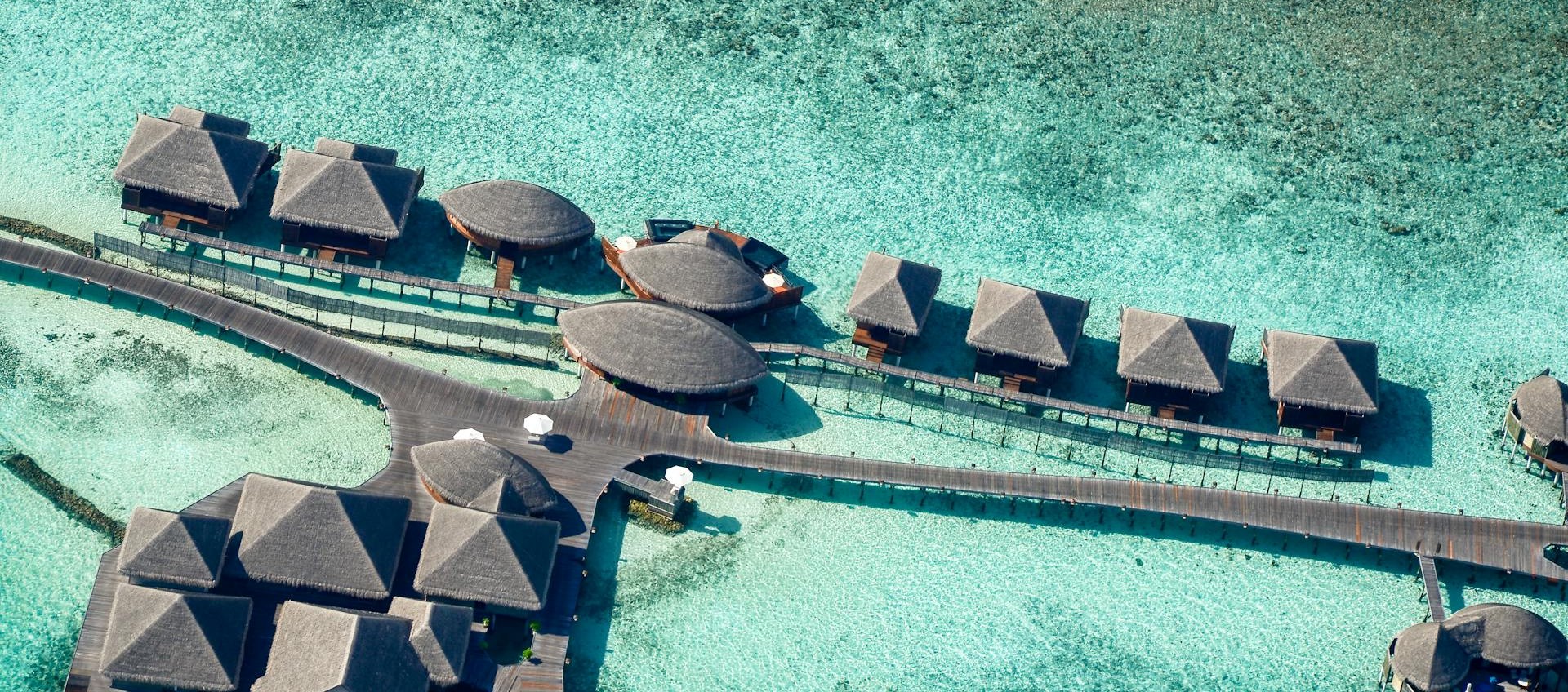 Overwater villa deck with turquoise lagoon