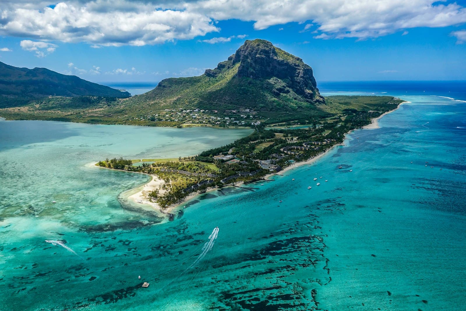 Aerial of Mauritius with Le Morne mountain rising over a turquoise lagoon