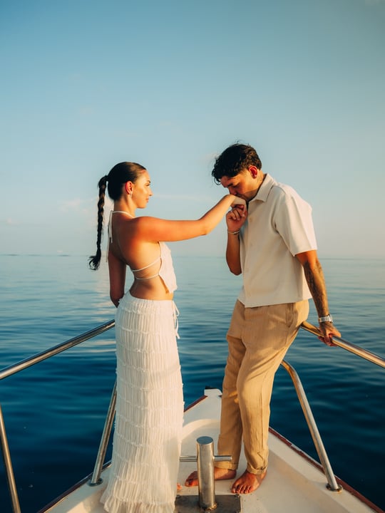 Photo by Adaaran Prestige Vadoo on April 28, 2026. May be an image of people kissing, boat, sail, yacht, wedding and text.