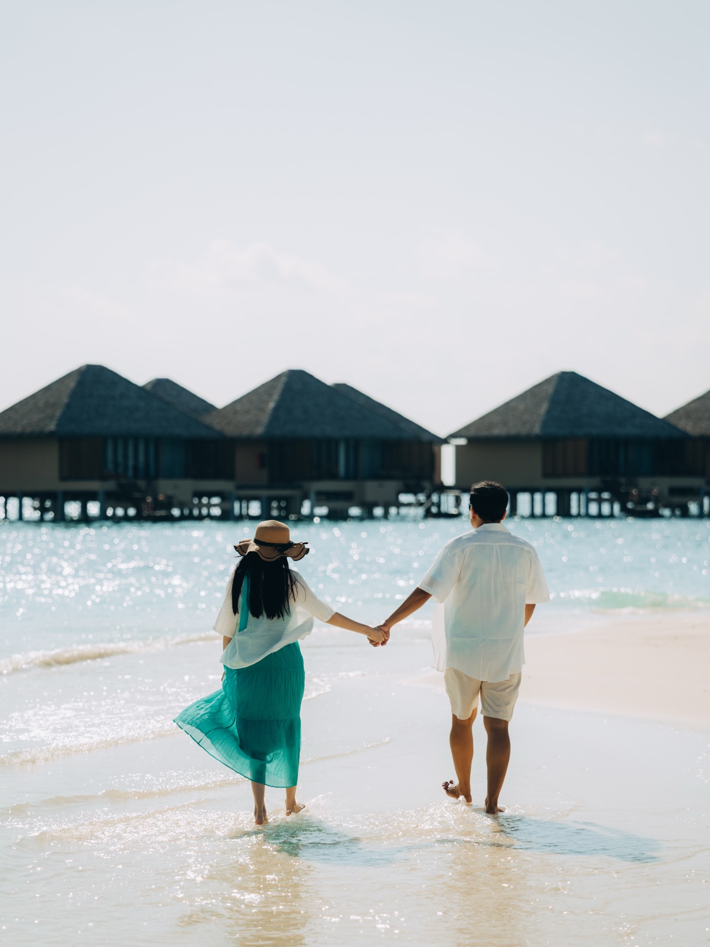 Photo by Adaaran Prestige Vadoo on April 30, 2026. May be an image of one or more people, people kissing, beach, ocean, water and text.