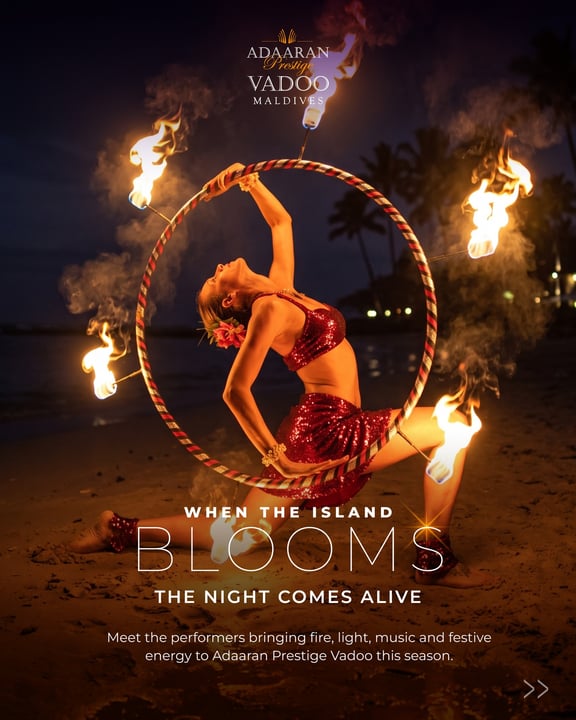 Foto von Adaaran Prestige Vadoo vom 20. August 2026. Zeigt möglicherweise Feuer, ein Poster, ein Magazin und Text mit der Aufschrift „ADAARAN Troilige VADOO MALDIVES D w WHEN THE ISLAND BLOOMS THE NIGHT COMES ALIVE Meet “