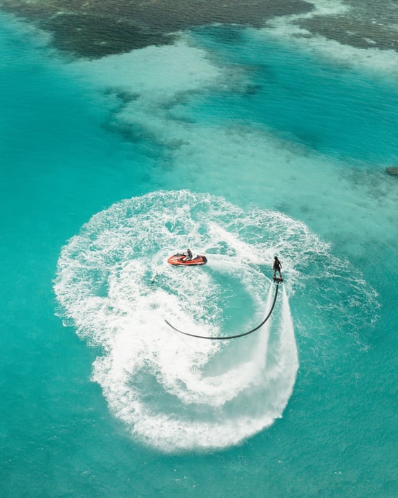 Photo by Adaaran Select Hudhuran Fushi on April 28, 2026. May be an image of parasail, helicopter, jet ski, speedboat, raft, kite and text.