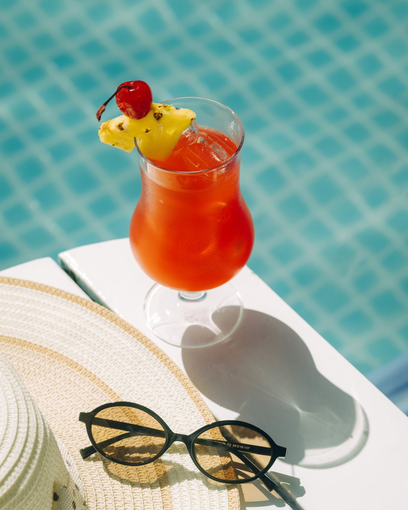 Photo by Adaaran Select Hudhuran Fushi on June 12, 2026. May be an image of strawberry daiquiri, parasol, sunglasses, umbrella, pool, cabana and text.