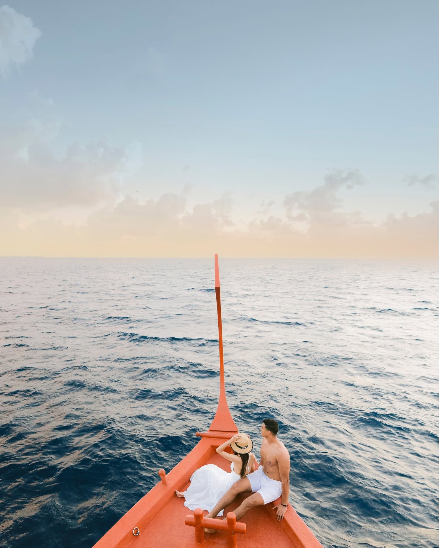 Out on open water, everything feels slower.
A traditional dhoni carries you across the atoll as the light softens and the sea becomes still. In these quiet moments, dolphins often appear in their natu