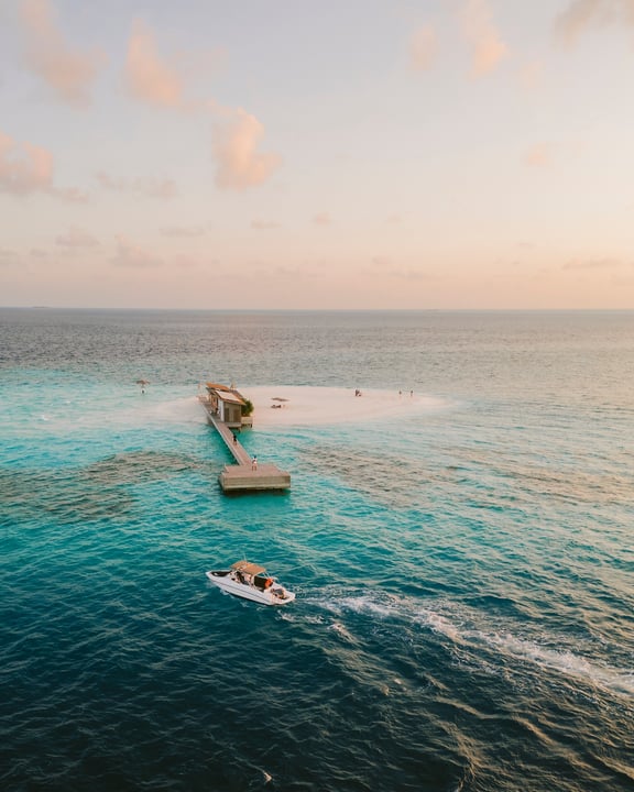 Photo by Alila Kothaifaru Maldives on April 20, 2026. May be an image of jet ski, helicopter, parasail, raft, speedboat, ocean, horizon and text.