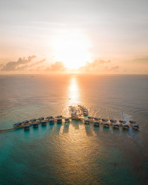 Photo by Alila Kothaifaru Maldives on April 29, 2026. May be an image of speedboat, yacht, horizon, twilight, ocean, water and text.