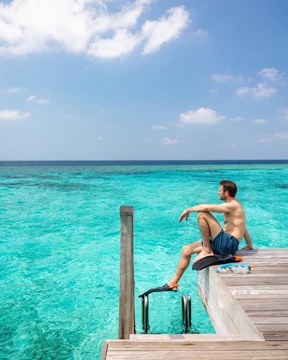 Where days begin in blue—and the world feels beautifully far away.

Wake up above crystal-clear waters.
Drift from ocean swims to slow, sunlit mornings.
Toast to nothing but time, space, and the art o