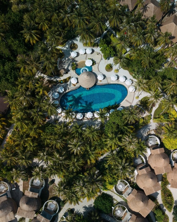 Photo by Bandos Maldives on April 21, 2026. May be an image of chaise longue, pool and text.