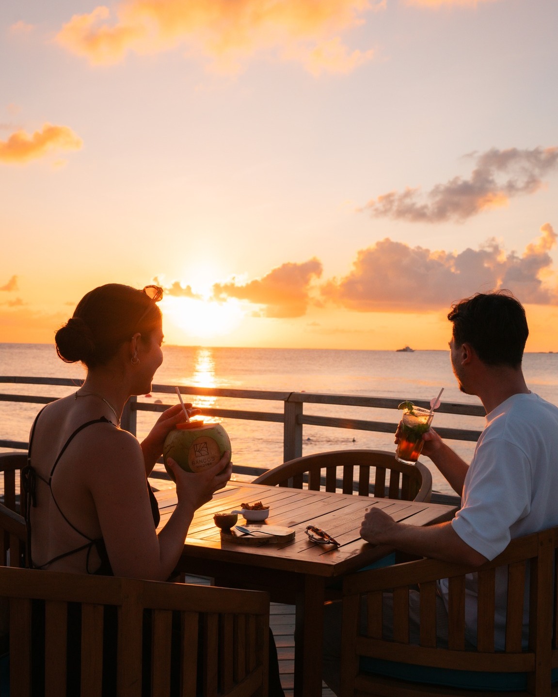 Photo by Bandos Maldives on April 30, 2026. May be an image of one or more people, twilight, outdoors and text.