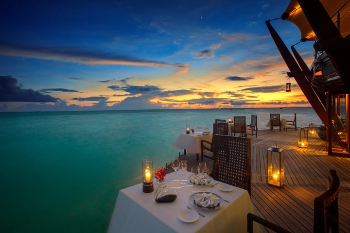Photo by Baros Maldives on May 02, 2026. May be an image of twilight and text.
