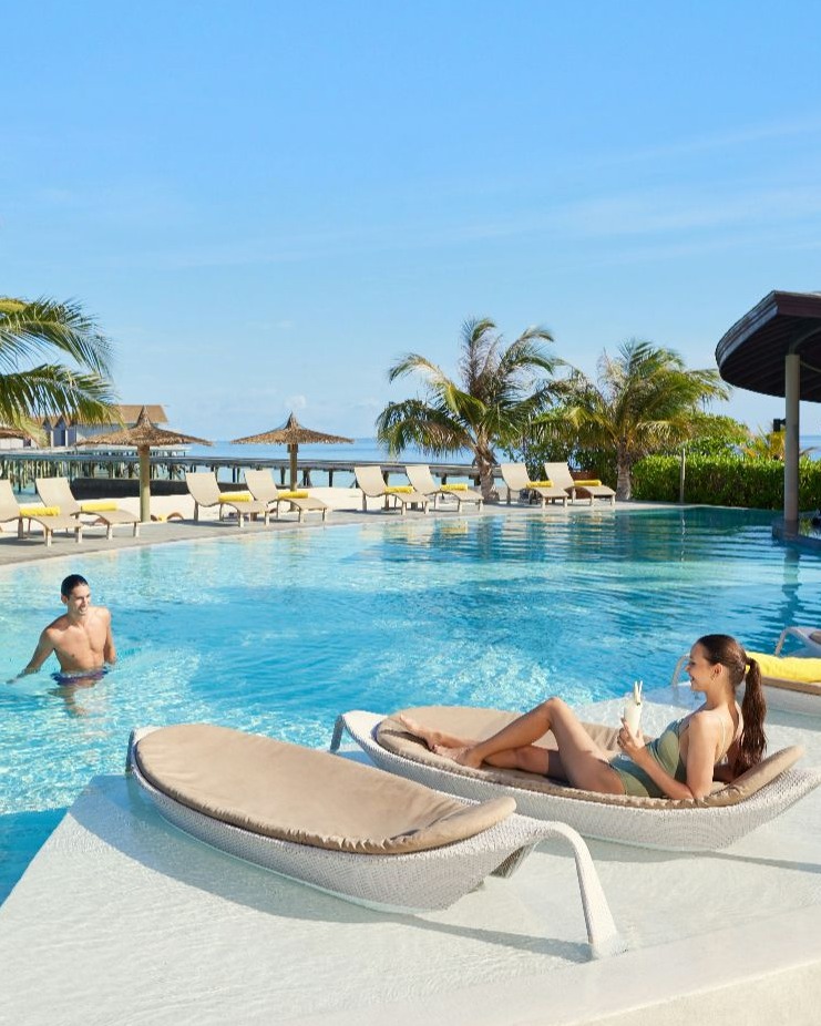 Photo by Centara Ras Fushi Resort & Spa Maldives in Centara Ras Fushi Resort & Spa Maldives with @explorecentara. May be an image of swimming, deck chair, chaise longue, pool, cabana and text.