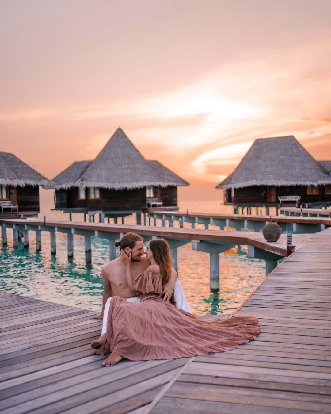 Photo by Coco Palm Dhuni Kolhu on July 26, 2026. May be an image of one or more people, people kissing, cabana, outdoors and text.