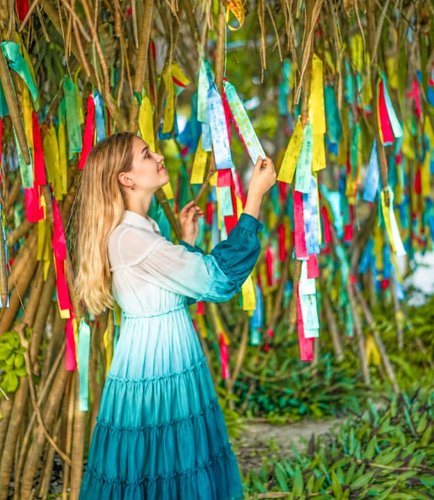 Photo by Cora Cora Maldives in Cora Cora Maldives. May be an image of macramé, wind chime, dress, parasol, sugarcane, bamboo, tree, outdoors and text.