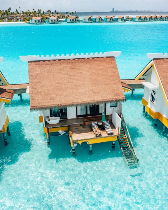 Photo by SAii Lagoon Maldives, Curio Collection by Hilton on June 15, 2026. May be an image of boathouse, cabana and text.