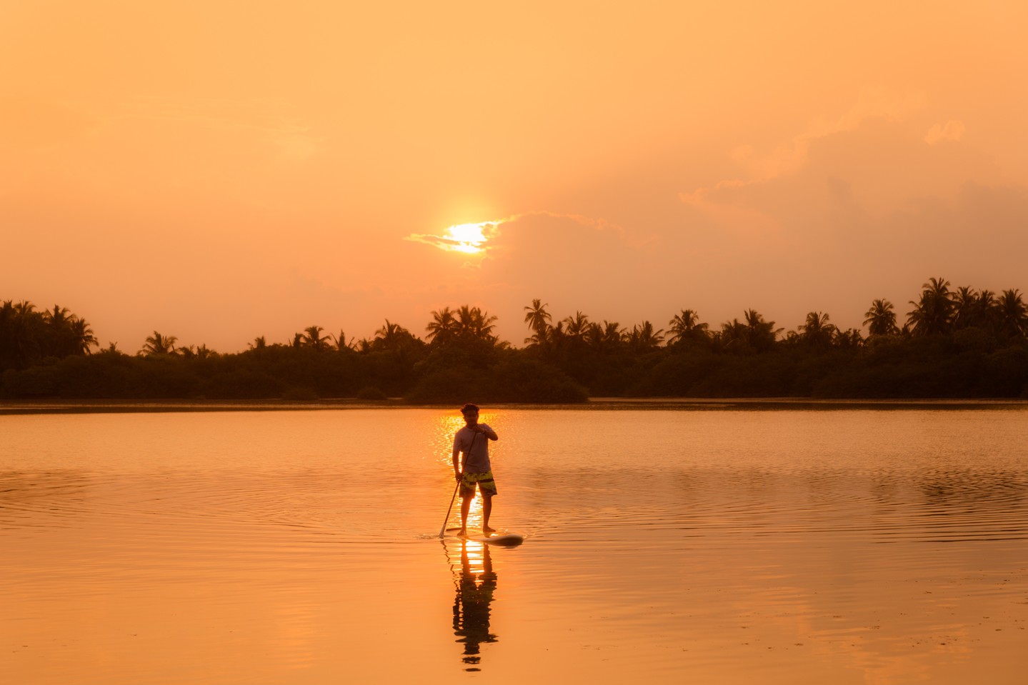 Photo by Equator Village Maldives in Equator Village. May be an image of fishing, twilight, lake and text.