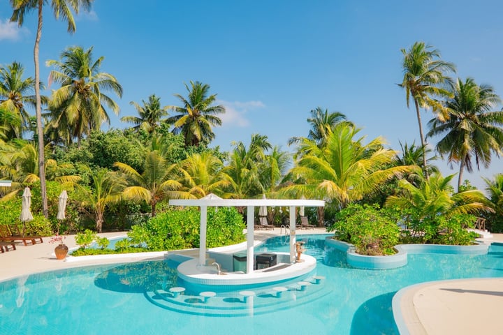 Photo by Equator Village Maldives on August 09, 2026. May be an image of chaise longue, pool, cabana and text.