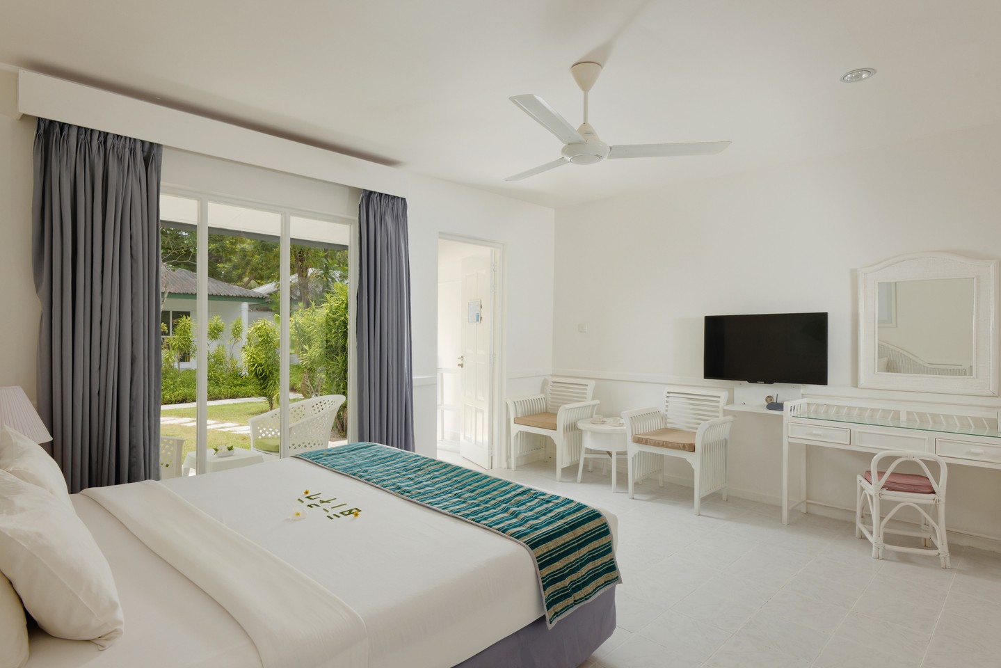 Photo by Equator Village Maldives in Equator Village. May be an image of bedroom and text.