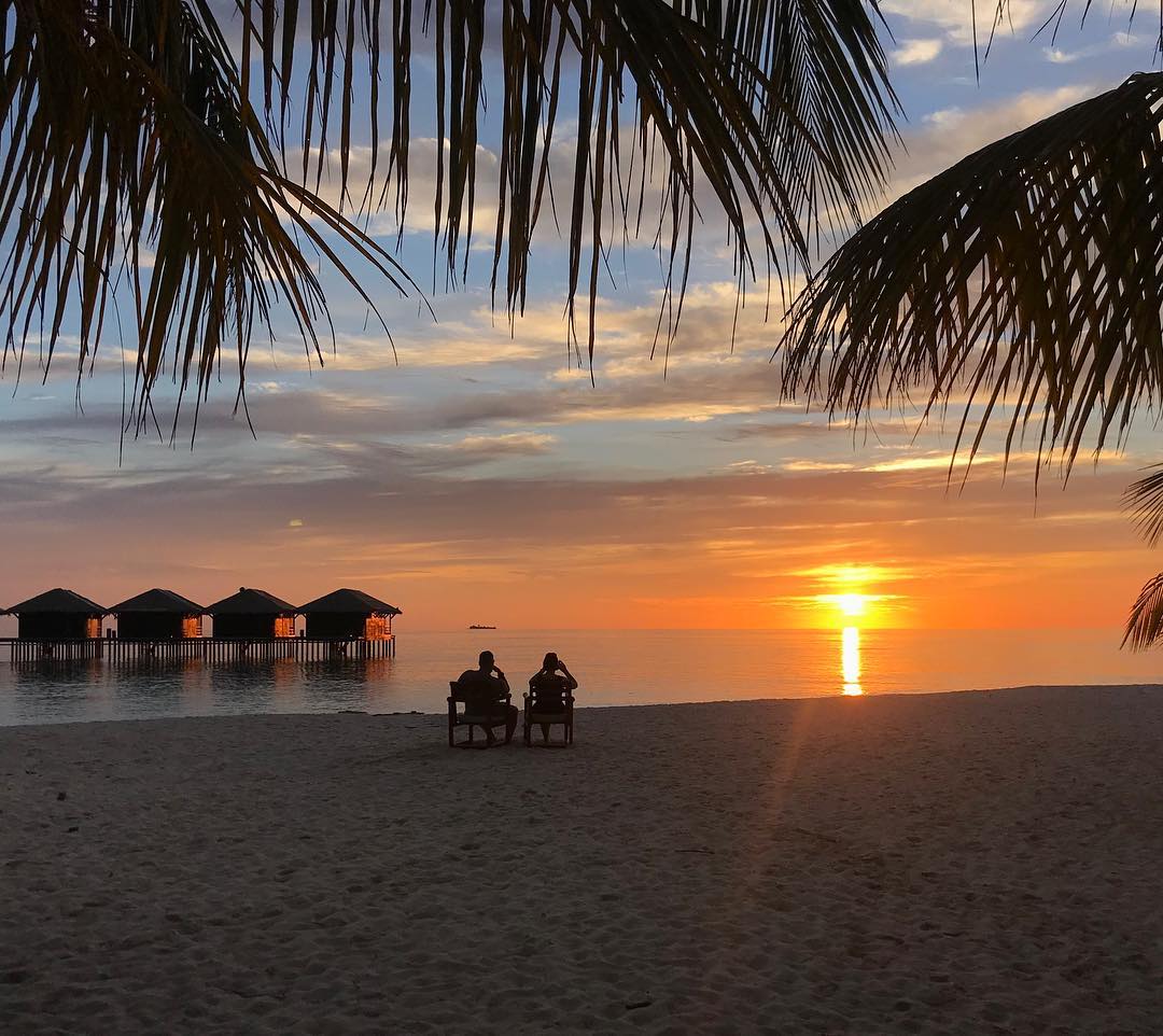 Photo by Filitheyo Island Resort on July 29, 2026. May be an image of beach, horizon, twilight, palm trees and text.