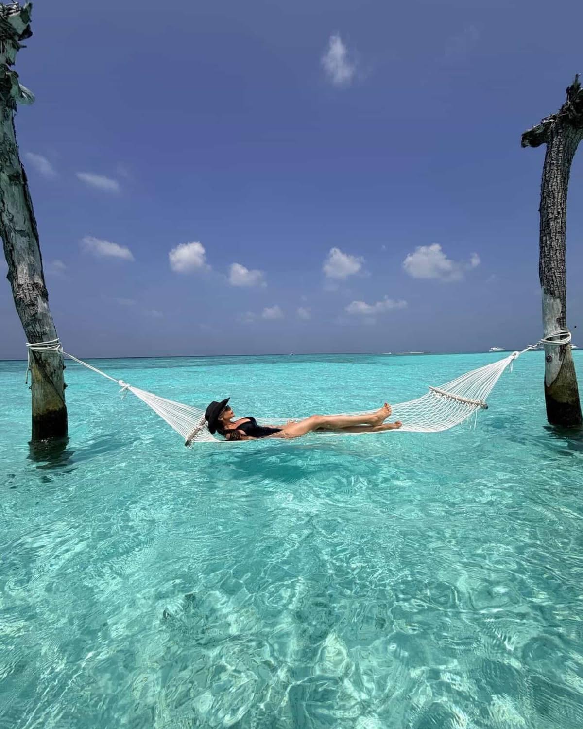Photo by Gili Lankanfushi, Maldives in Gili Lankanfushi, Maldives. May be an image of hammock, ocean and text.