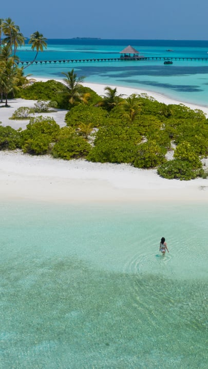 Every year, my summers begin here…

In the Maldives, with the sun and the sea, an endless open sky, and those impossible shades of aqua

Barefoot days, balmy nights, shimmering water as far as the eye