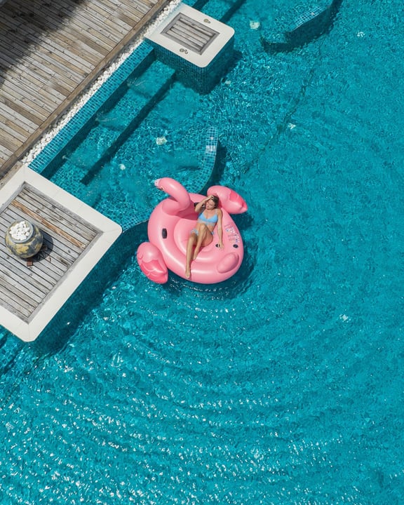 Photo by Grand Park Kodhipparu on April 29, 2026. May be an image of swimming, flamingo, raft, chaise longue, pool and text.