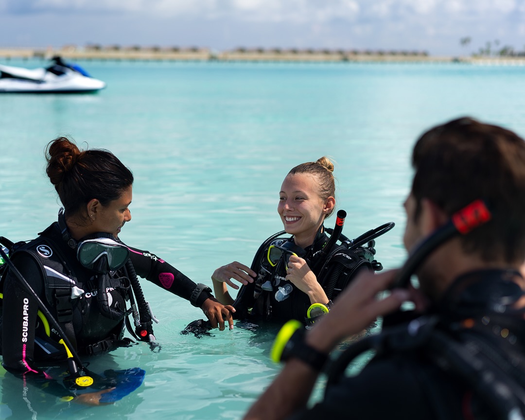 Photo shared by CROSSROADS Maldives on August 06, 2026 tagging @saiilagoonmaldives, and @hardrockhotelmaldives. May be an image of swimming, snorkel, glasses, wetsuit and text.