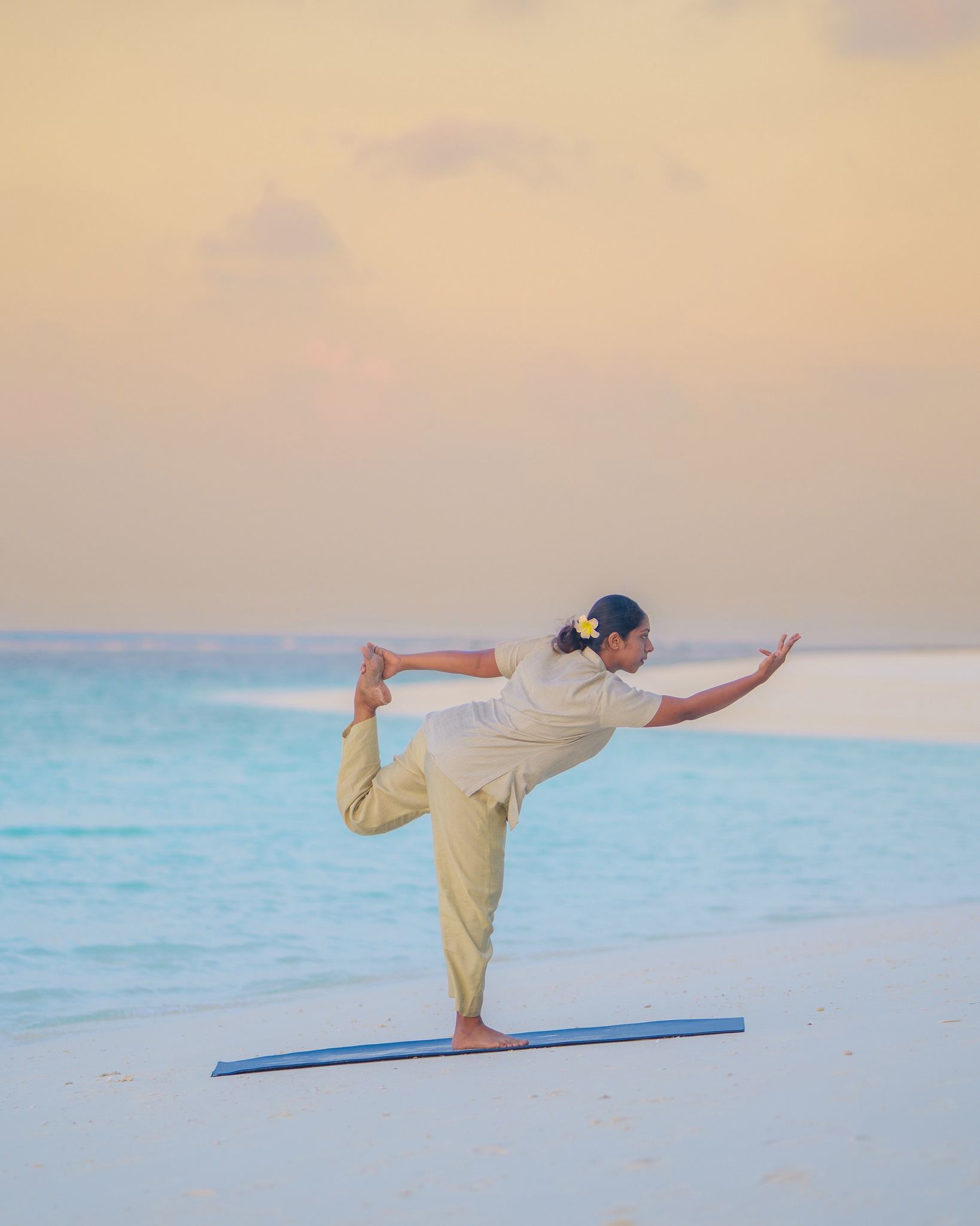 Photo by Hideaway Beach Resort & Spa on April 15, 2026. May be an image of yoga, dancing, standing, beach, body of water and text.