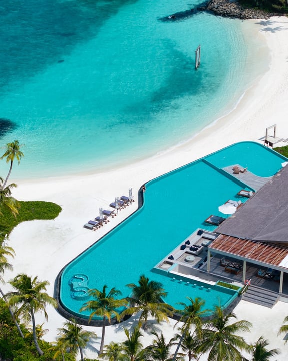 Photo by Hilton Maldives Amingiri on June 12, 2026. May be an image of swimming, pool, cabana and text.