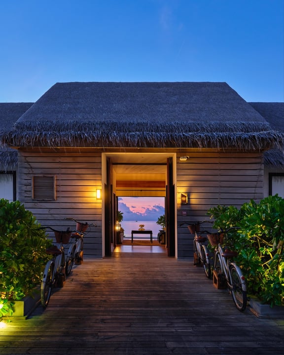 Photo by Hilton Maldives Amingiri on June 14, 2026. May be an image of twilight, boathouse and text.