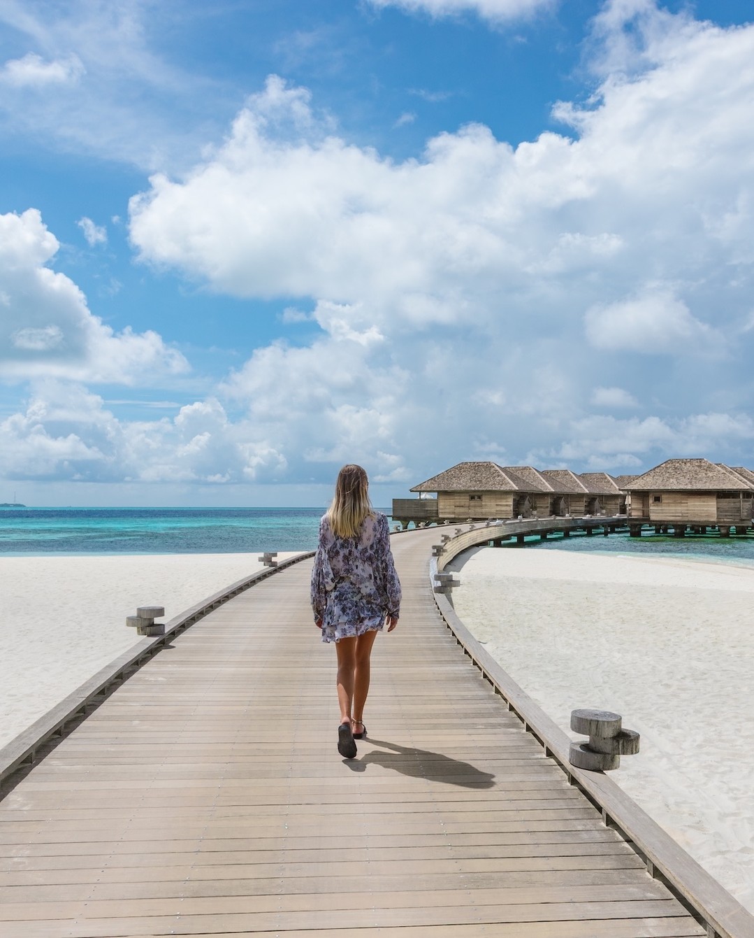 Photo by Hurawalhi Maldives in Hurawalhi Maldives. May be an image of sundress, sarong, beach, ocean, water and text.
