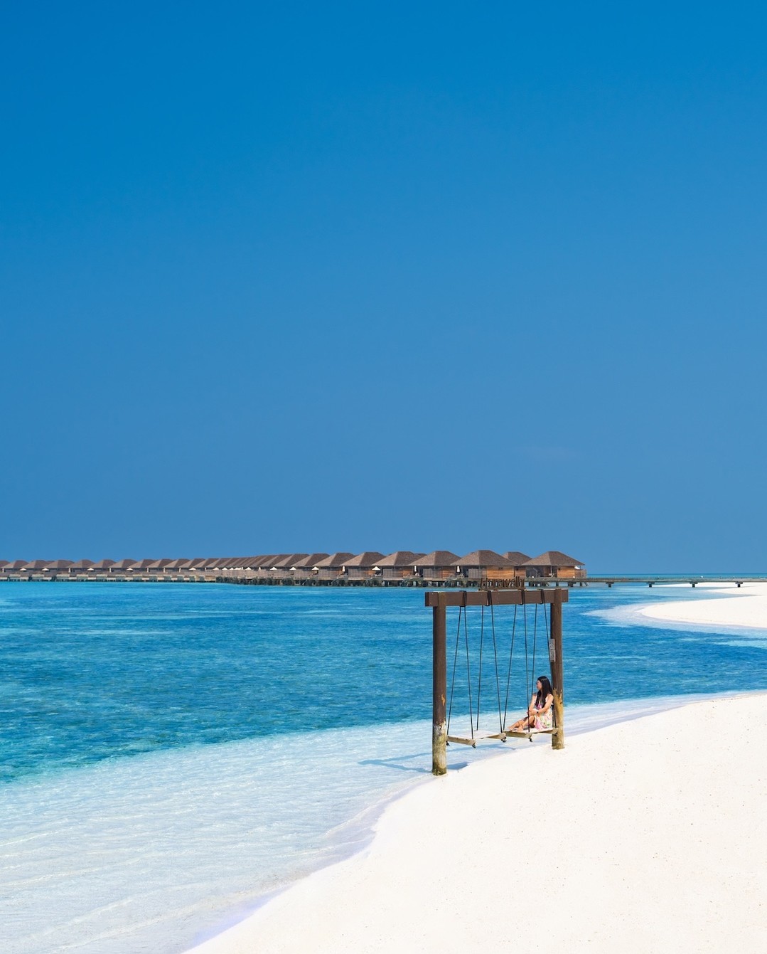 Photo by Hurawalhi Maldives in Hurawalhi Maldives. May be an image of beach, ocean, water, cabana and text.
