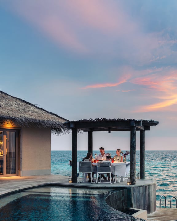 Photo by InterContinental Maldives in InterContinental Maldives Maamunagau Resort. May be an image of twilight, pool, cabana, outdoors and text.
