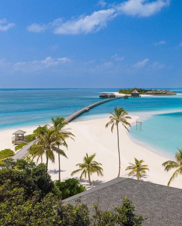 Foto von Jawakara Maldives in Jawakara Maldives. Könnte ein Bild von Ozean, Strand, Horizont, Palmen und Text sein.