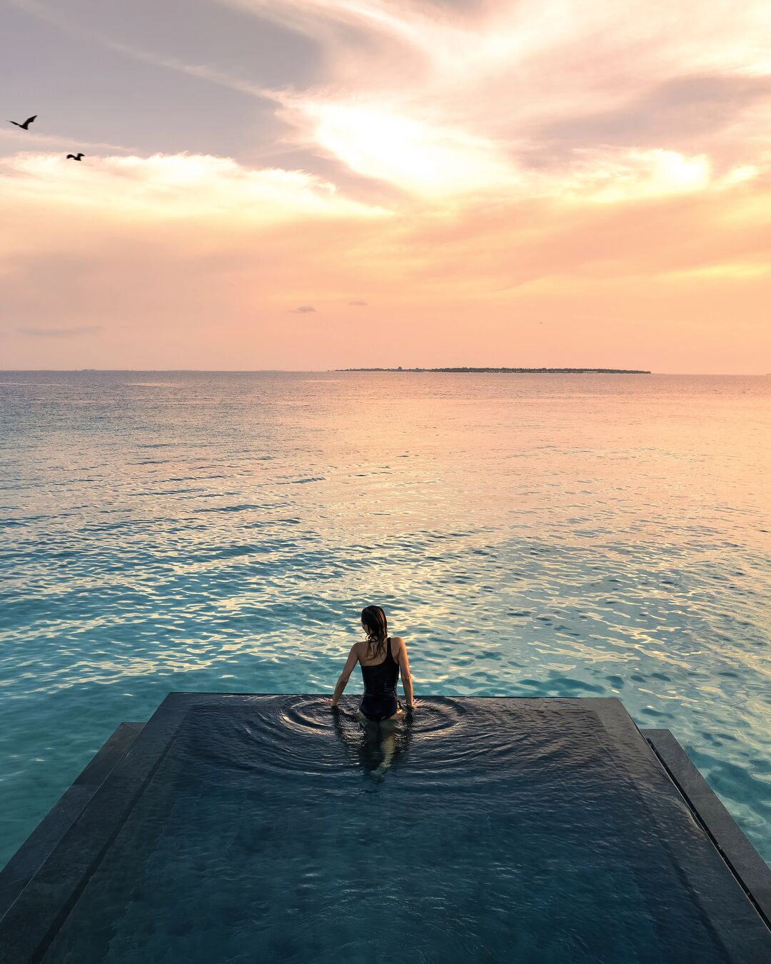 A private infinity pool opens to the lagoon, while airy interiors keep the horizon always within view. Designed for days that move with the ocean, our overwater villas make room to slow down and align