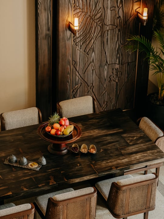 Photo by JOALI Maldives on July 30, 2026. May be an image of table, macramé, lighting, kitchen table, armoire, dining table, indoors, barn door and text.
