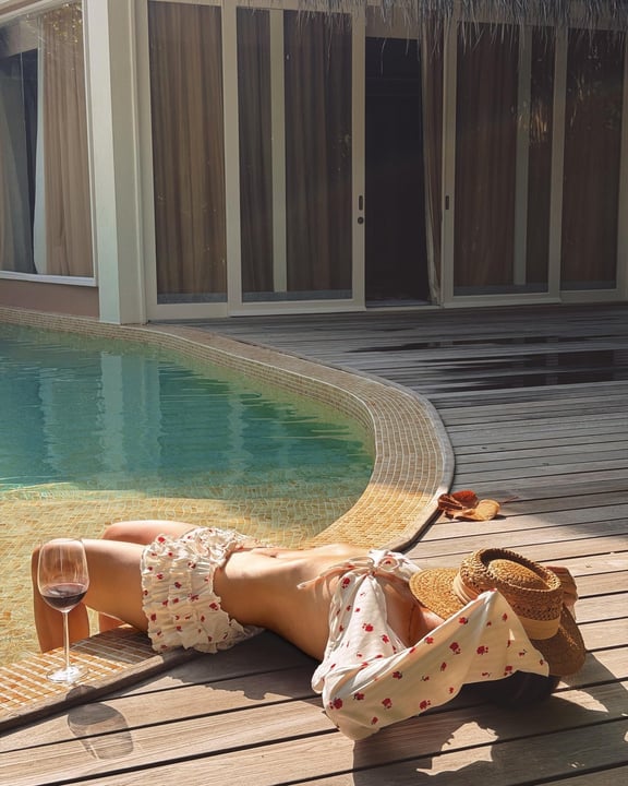Photo by JW Marriott Maldives Resort & Spa on August 12, 2026. May be an image of deck chair, chaise longue, sarong, pool and text.