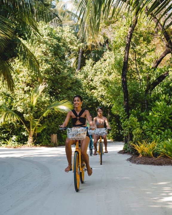 Photo by Kandima Maldives on August 04, 2026. May be an image of bicycle, palm trees, outdoors and text.