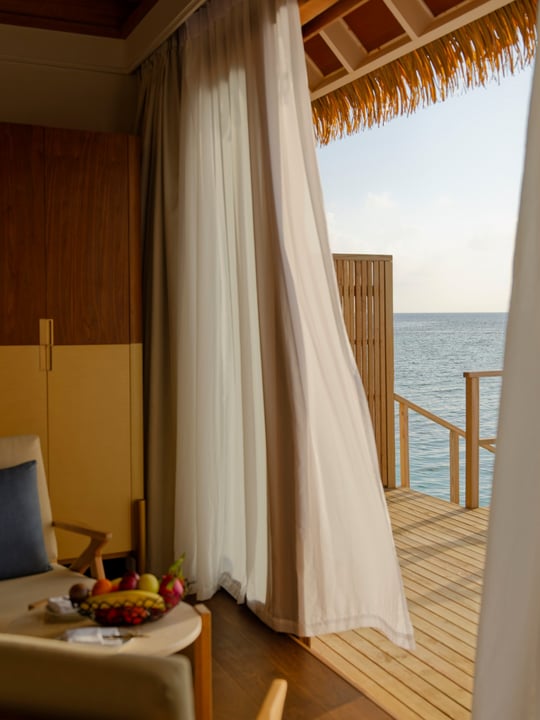 Photo by Kandolhu Maldives in Kandolhu Maldives. May be an image of mosquito net, bed, chaise longue, curtains, cabana and text.