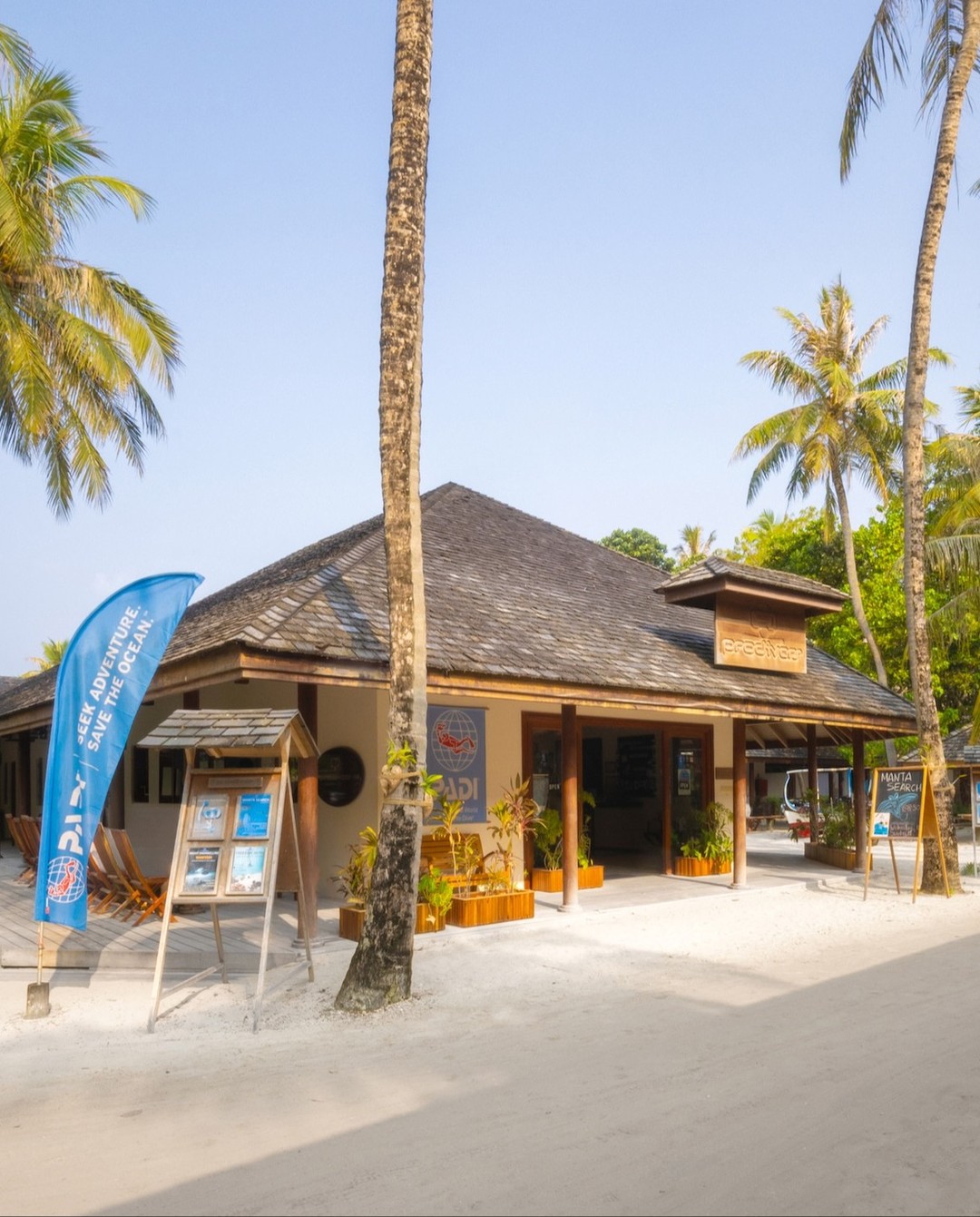 Photo by Kuredu Island Resort & Spa in Kuredu Island Resort with @prodiversmaldives. May be an image of ‎signboard, beach, palm trees, cabana and ‎text that says "‎VENTURE. OCEAN CEAN. ENTURE ADV THE 