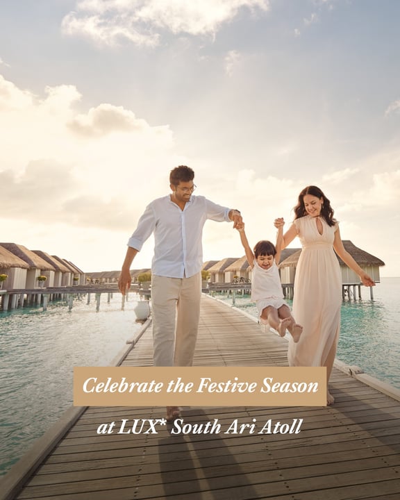 Photo by LUX* South Ari Atoll on August 11, 2026. May be an image of one or more people, sundress, magazine, dress, poster, wedding, outdoors and text that says "ドカッ Celebrate the Festive Season Seaso