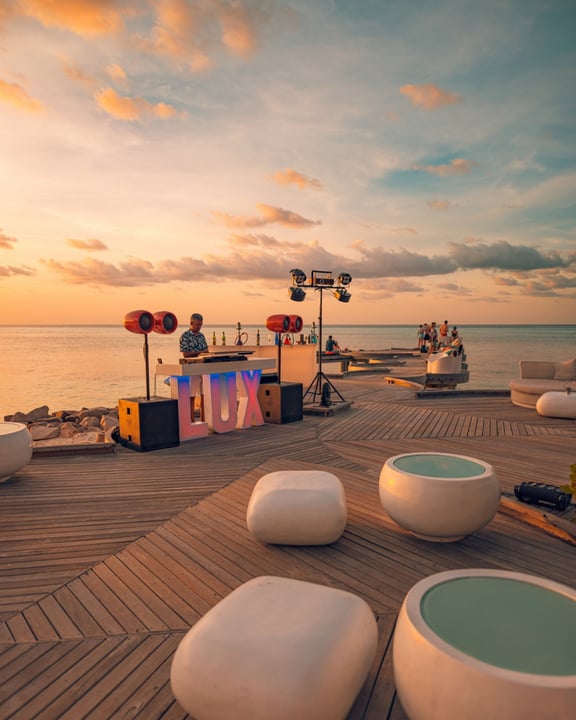 Photo by LUX* South Ari Atoll on August 11, 2026. May be an image of deck chair, twilight, horizon, cabana and text.