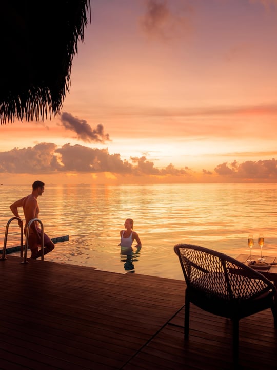 Photo by Mercure Maldives Kooddoo on June 18, 2026. May be an image of one or more people, deck chair, twilight, ocean, horizon, water and text.