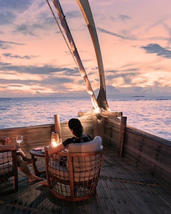 Photo by Milaidhoo Maldives on August 28, 2026. May be an image of boat, sail, twilight, ocean, houseboat and text.