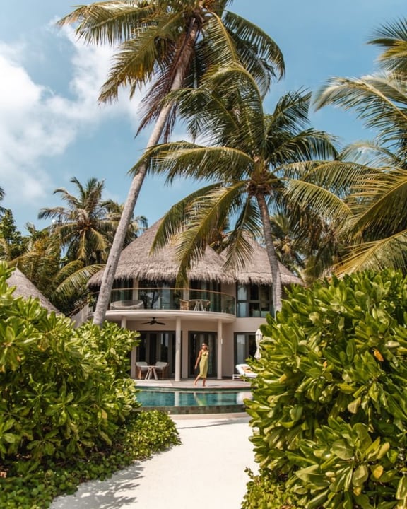 Photo by The Nautilus Maldives on June 16, 2026. May be an image of palm trees, cabana and text.