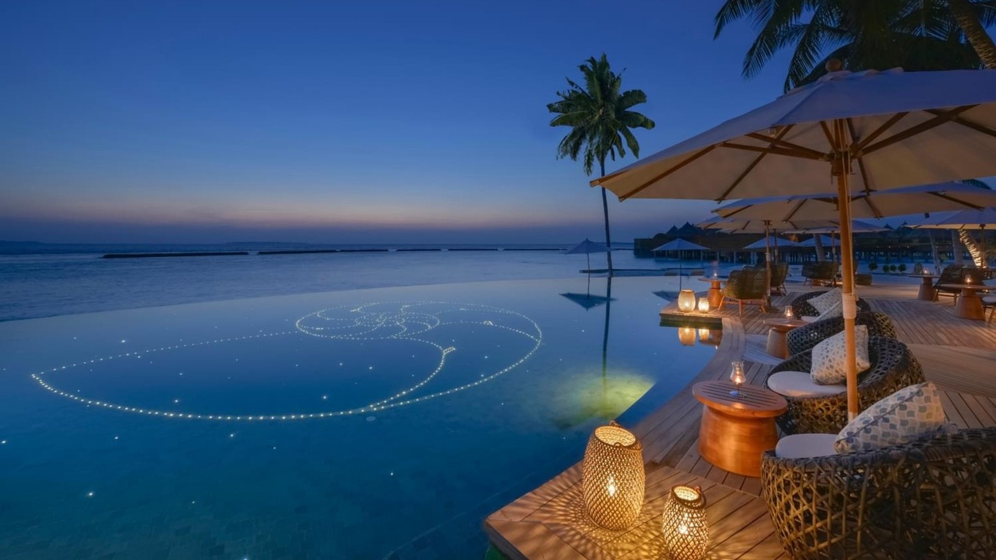 Photo by The Nautilus Maldives on August 06, 2026. May be an image of twilight, pool, horizon, cabana and text.