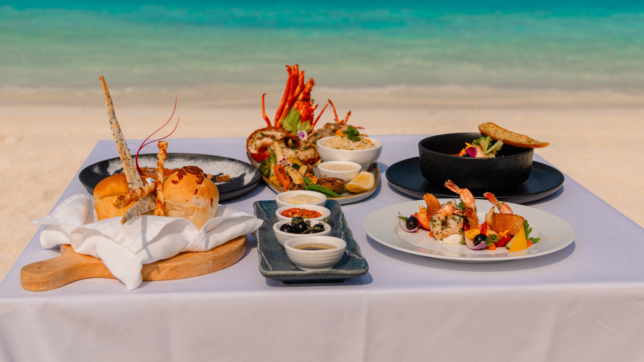 LOBSTER BEACH DINNER

Experience a culinary narrative where the ocean provides the ultimate backdrop. At NOOE, we have choreographed a private dining experience designed to harmonize with the rhythmic