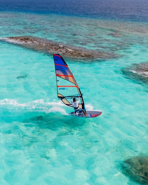 Photo by Nova Maldives on August 08, 2026. May be an image of boat racing, sail, sailing boat, kite, water and text.