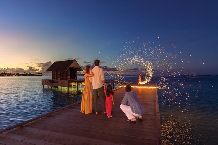 Photo by OBLU XPERIENCE Ailafushi on June 14, 2026. May be an image of sparkler, twilight, wedding, boathouse and text.